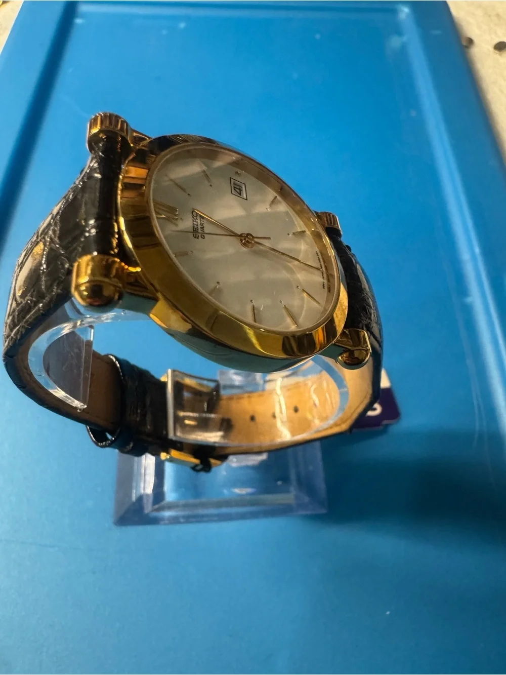 Seiko Gold Tone Watch with White Dial and Black Strap